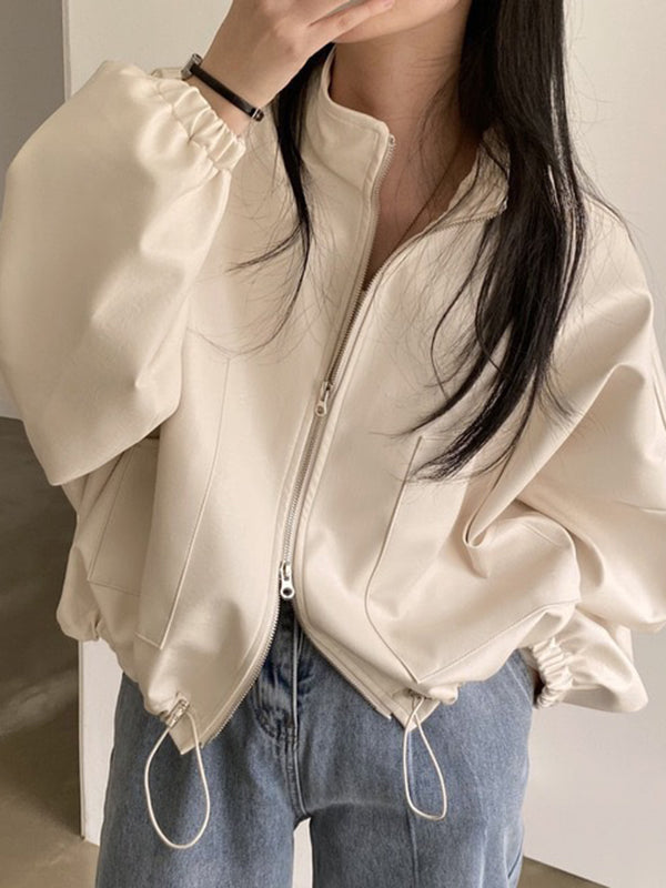 Oversized faux leather bomber jacket with a stand collar and drawstring hem in cream