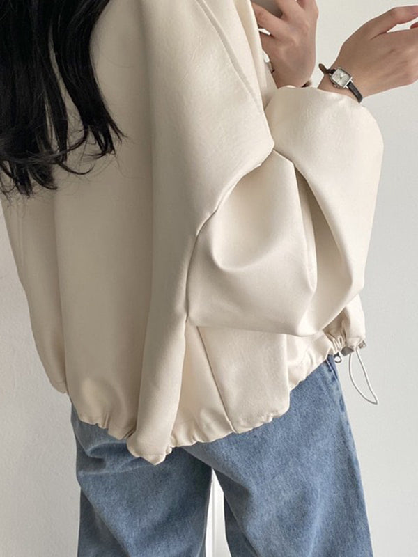 Oversized faux leather bomber jacket with a stand collar and drawstring hem