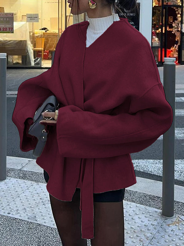Short wrap coat with a deep V-neck and a self-tie belt
