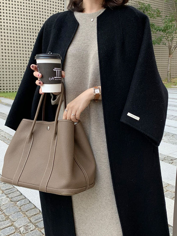 Collarless longline coat with dropped sleeves and an open front