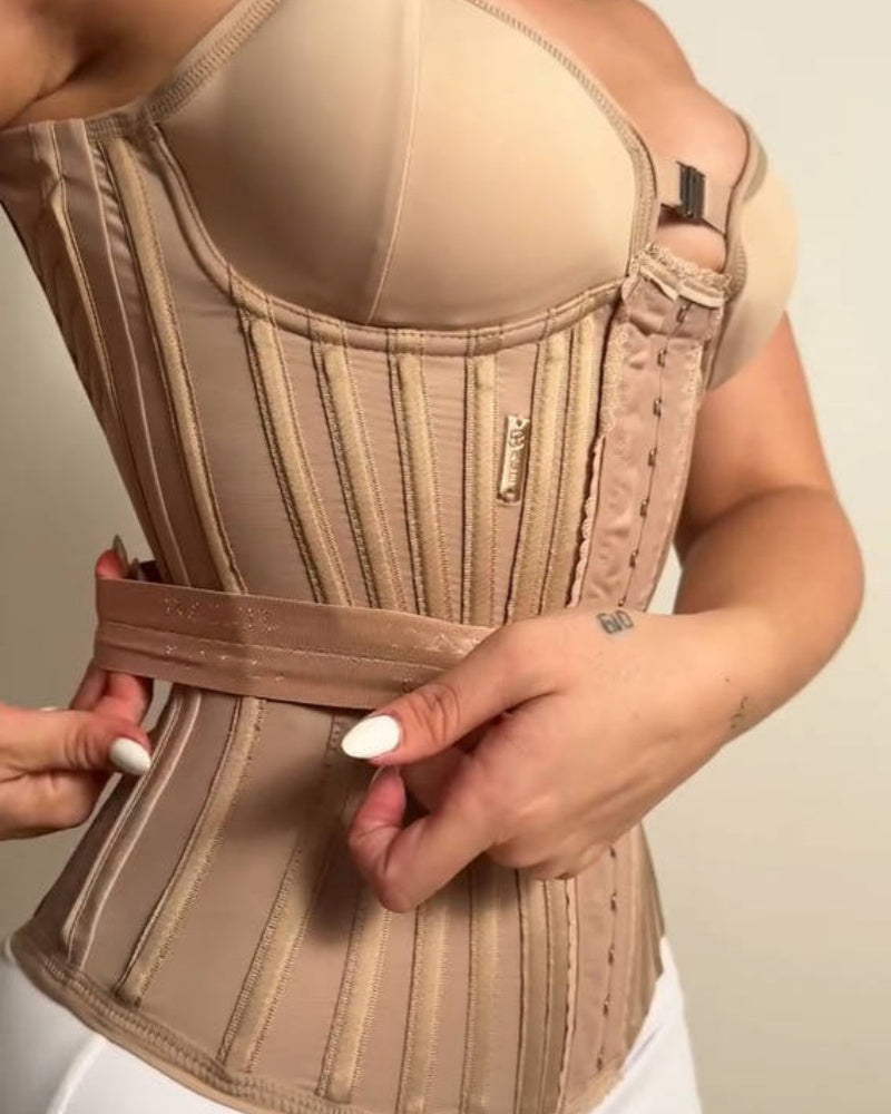 Long boned corset with moulded cups, adjustable straps and hook-and-eye front