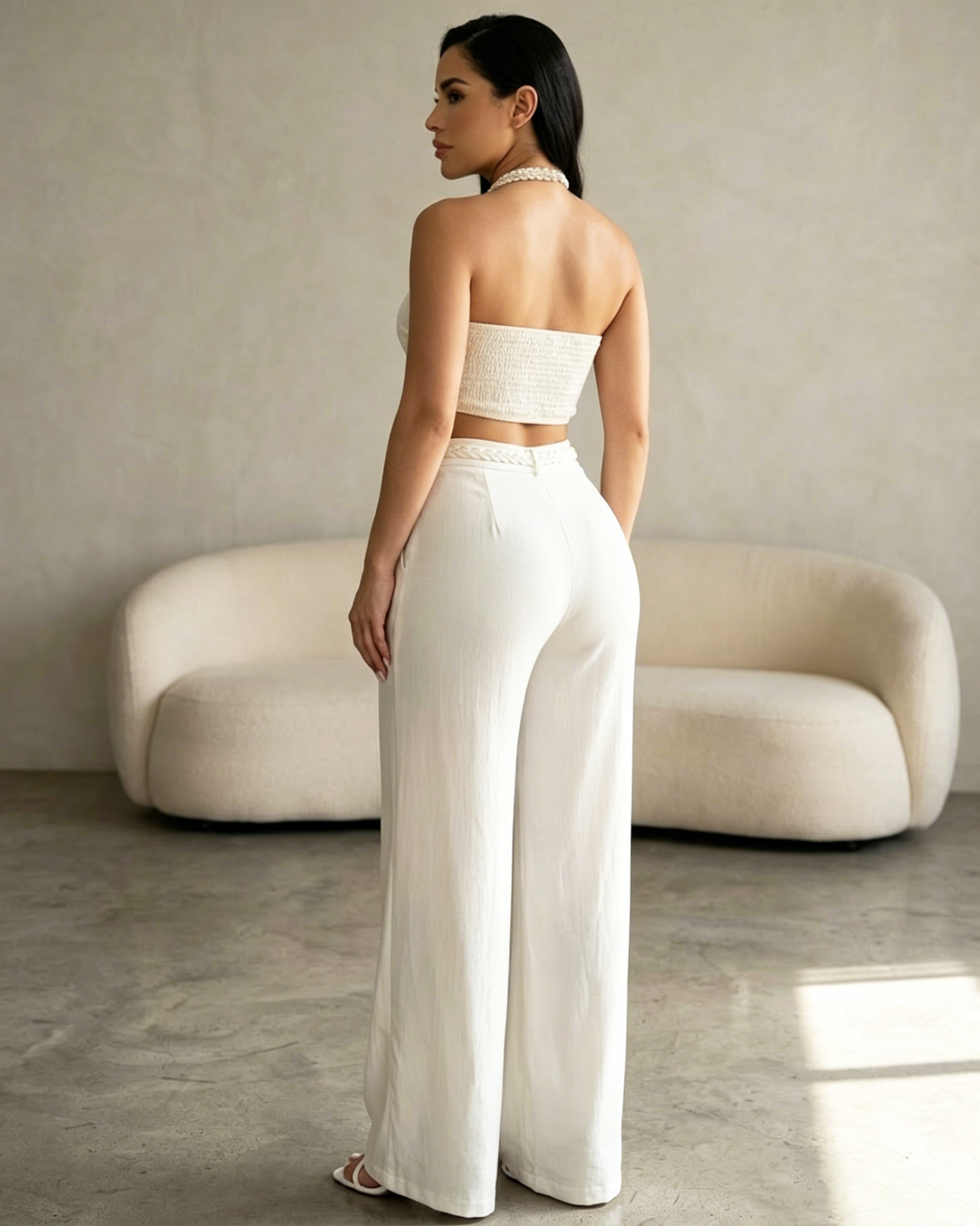Two-piece set with a braided halter crop top and high-waisted wide-leg trousers