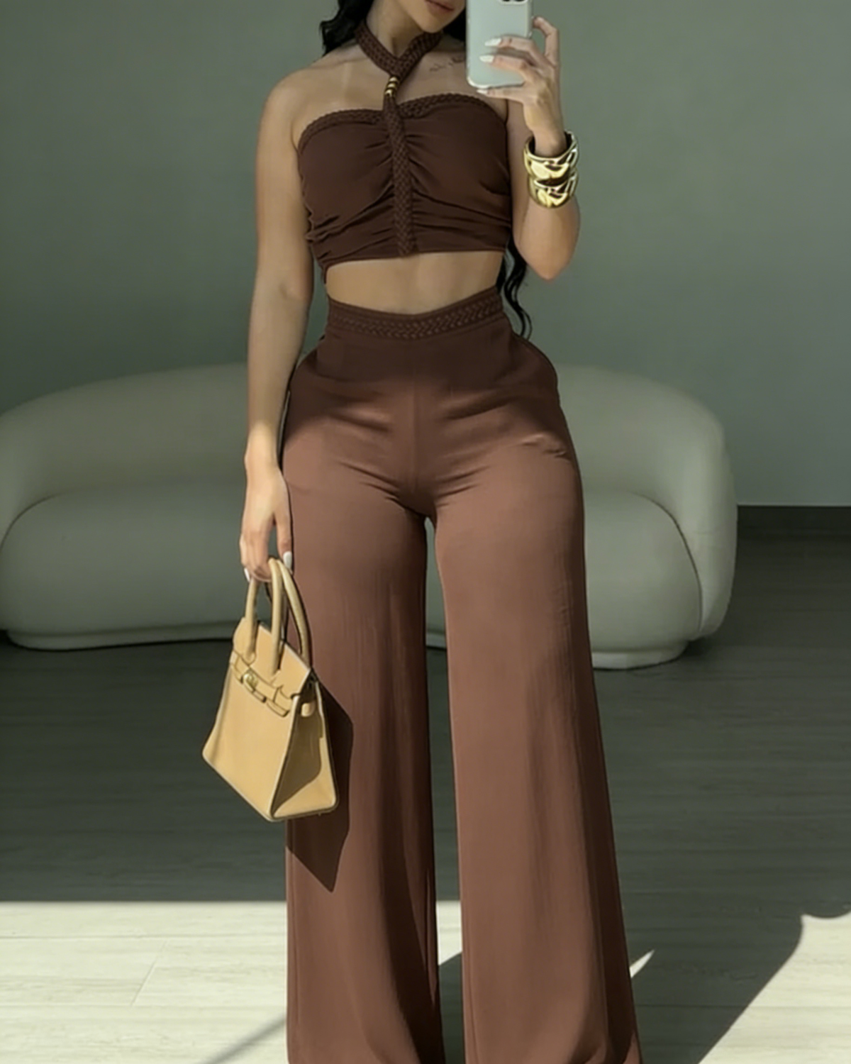 Two-piece set with a braided halter crop top and high-waisted wide-leg trousers