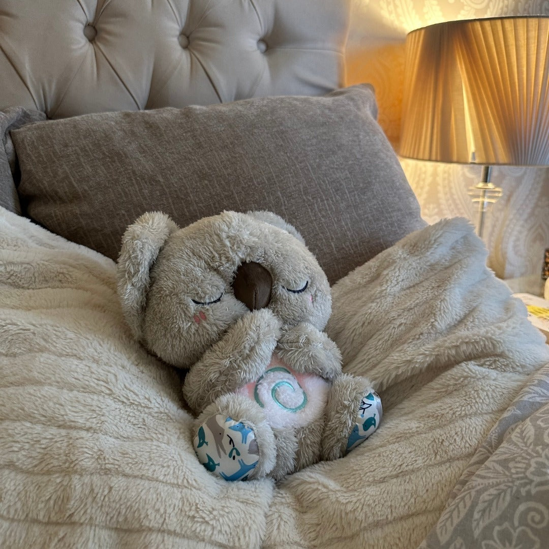 Breathing koala soft toy with a night light in its tummy