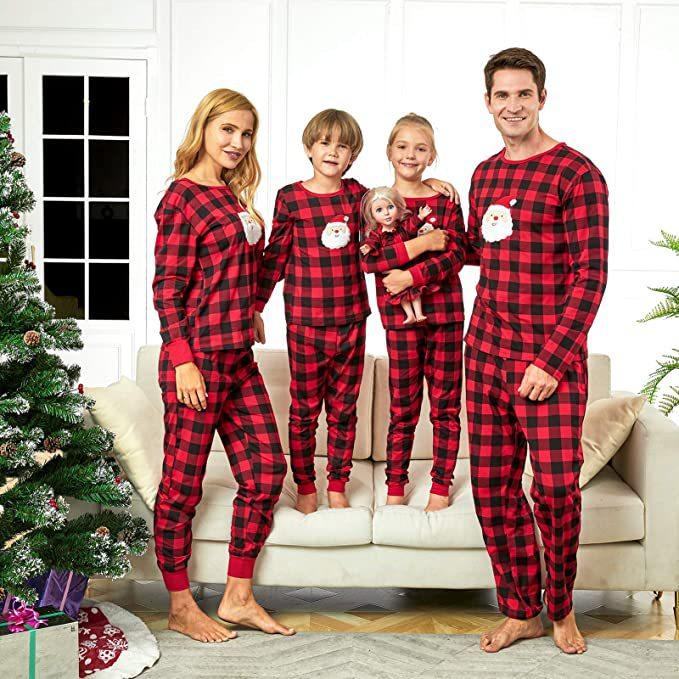Red and black check family Christmas pyjamas with a Father Christmas face