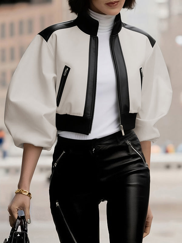 Cropped cream bomber jacket with black contrast panels and a zip front in cream