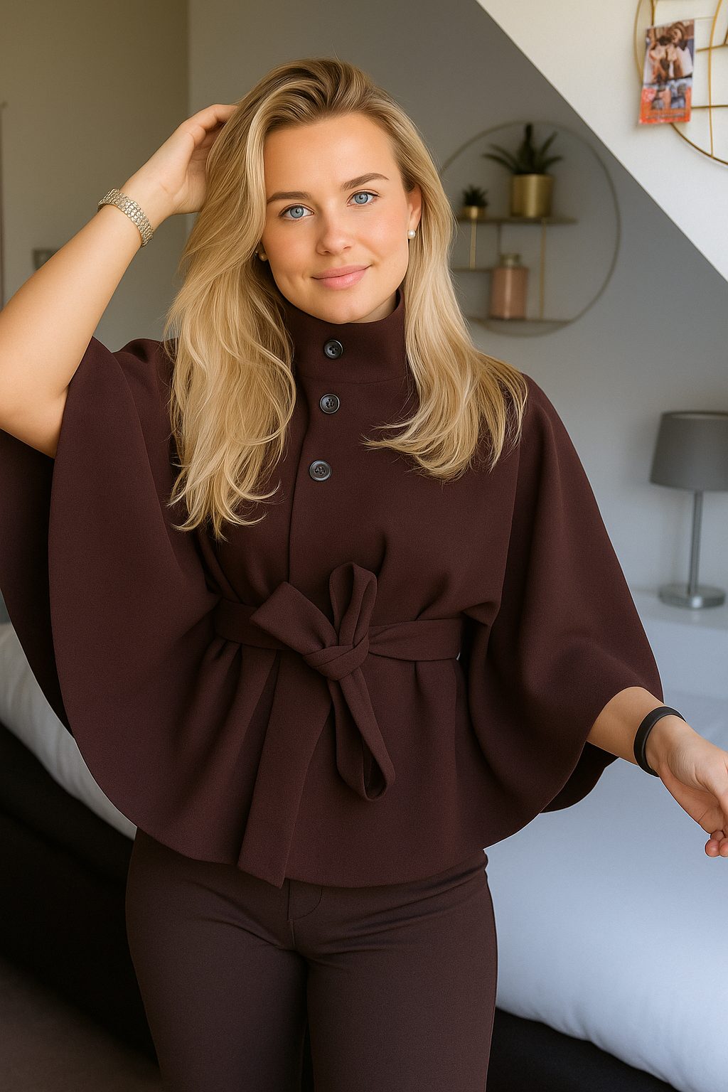 Women's cape coat with a high collar and tie belt