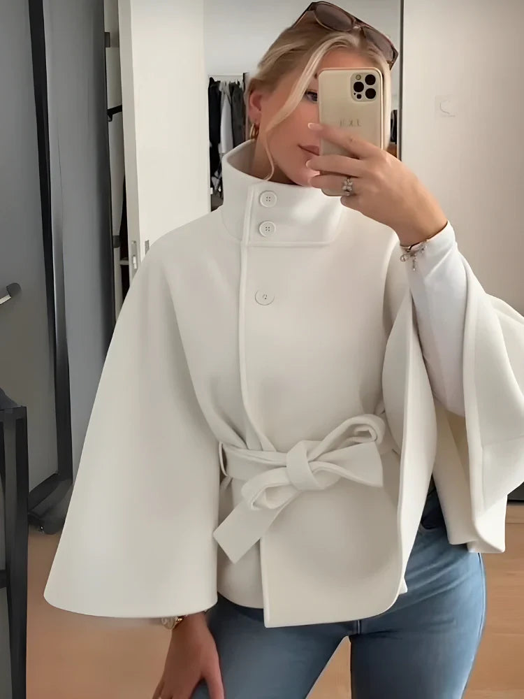 Women's cape coat with a high collar and tie belt