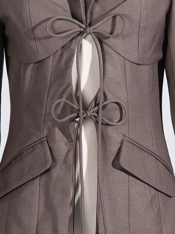 Tie-front blazer with a notch lapel and two flap pockets
