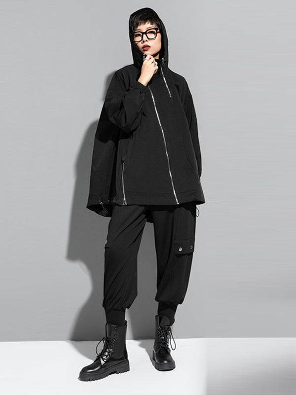 Oversized black hooded jacket with an off-centre zip and drawstring hem