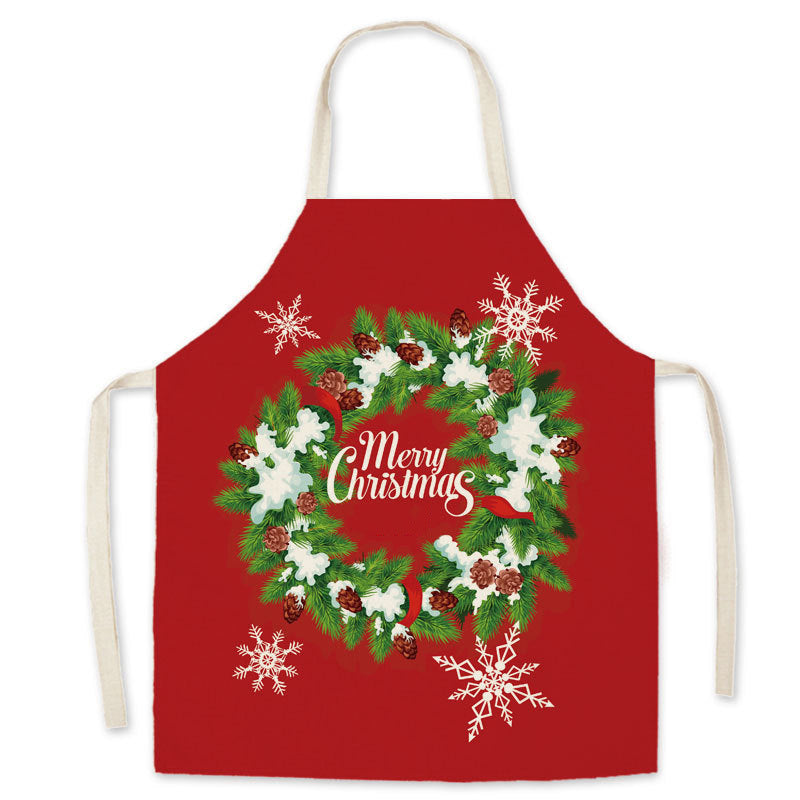 Red Christmas apron with a neck loop, long ties and a festive print on the front - christmas wreath