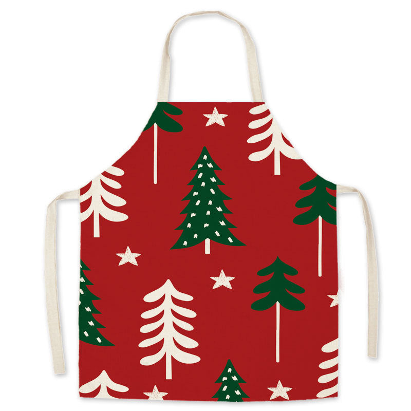 Red Christmas apron with a neck loop, long ties and a festive print on the front - christmas trees