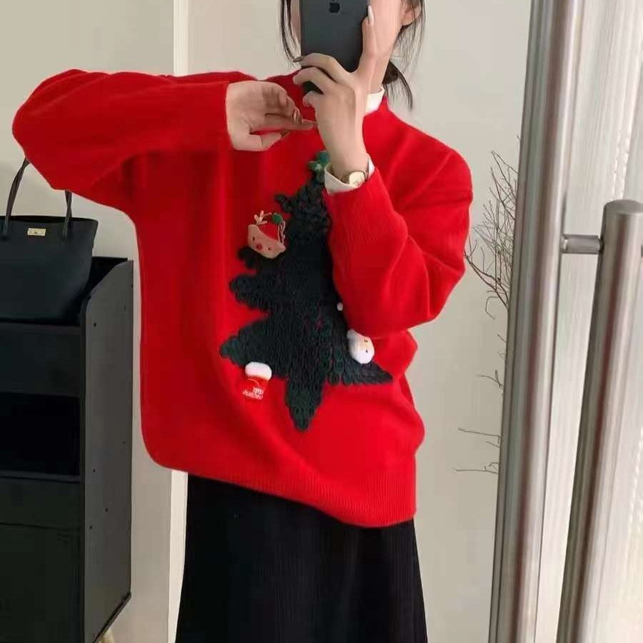 Women's knitted Christmas jumper with a raised 3D tree and small appliqués