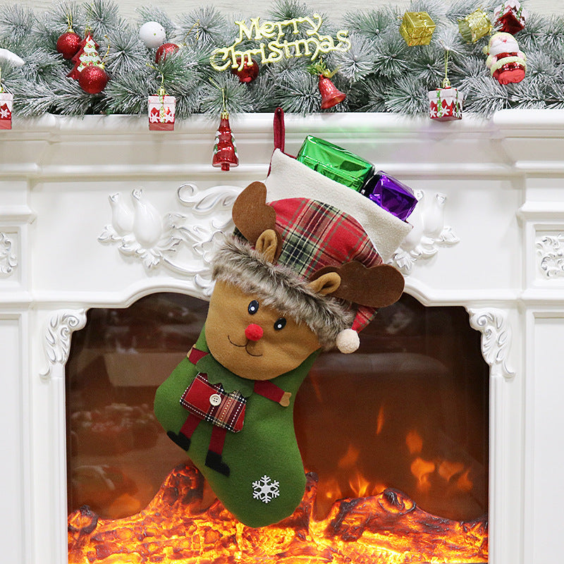 Christmas stocking with a 3D figure in a tartan hat and a white cuff by the fire
