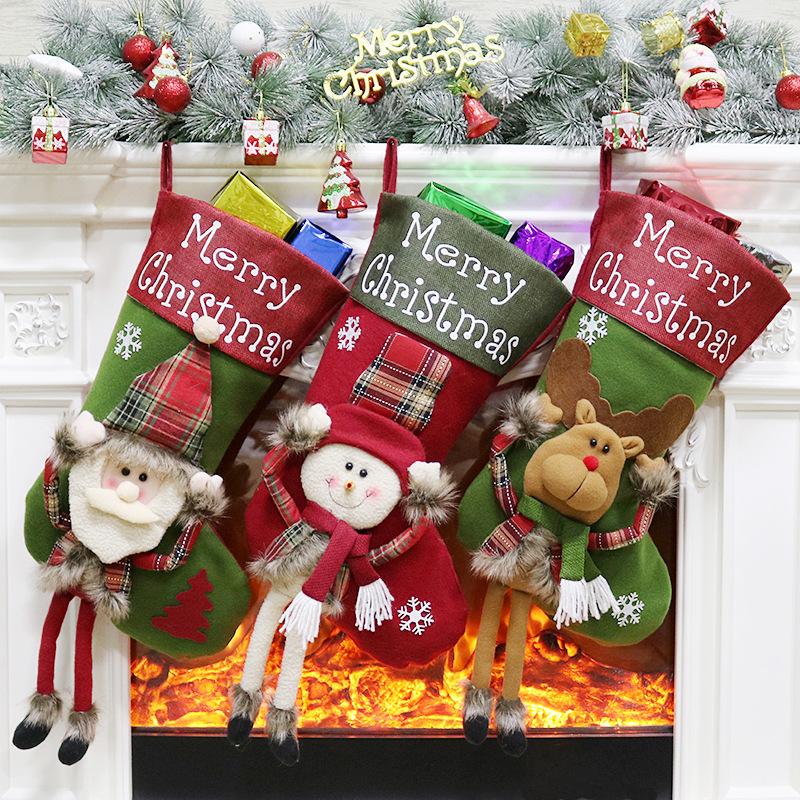 Large Christmas stocking with a dangling-leg character and Merry Christmas cuff