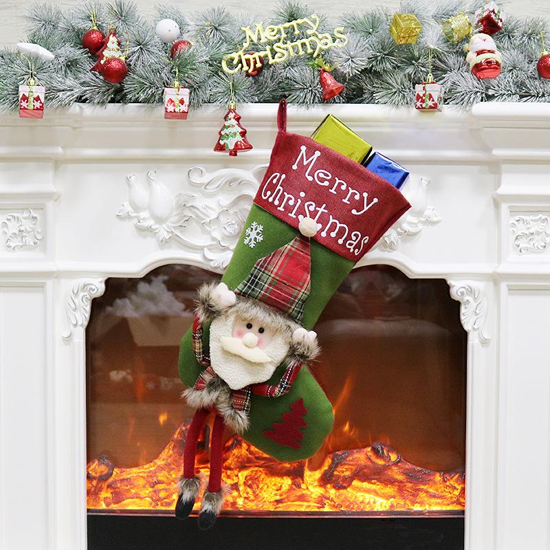 Large Christmas stocking with a dangling-leg character and Merry Christmas cuff