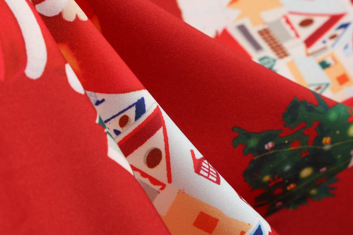 Women's Christmas swing dress with black bodice, bow belt and festive print