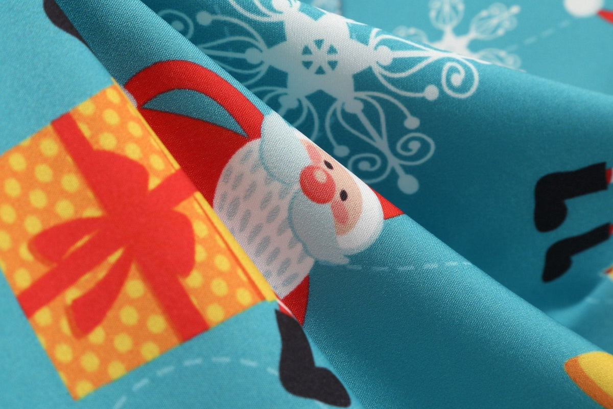 Women's Christmas swing dress with black bodice, bow belt and festive print