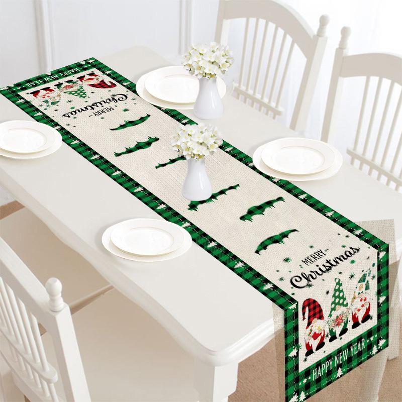 Christmas table runner, 30 x 180 cm, with a festive print on a laid table - green and beige with gnomes