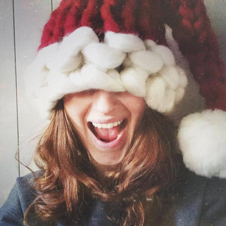 Chunky knit Christmas hat with a thick white trim and white pompom