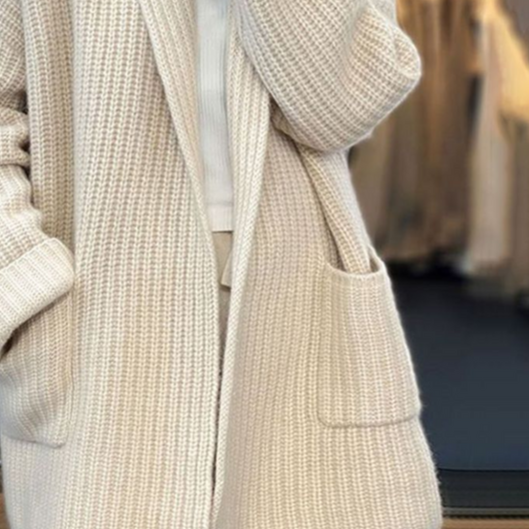 Women's chunky ribbed longline cardigan with a shawl collar and pockets
