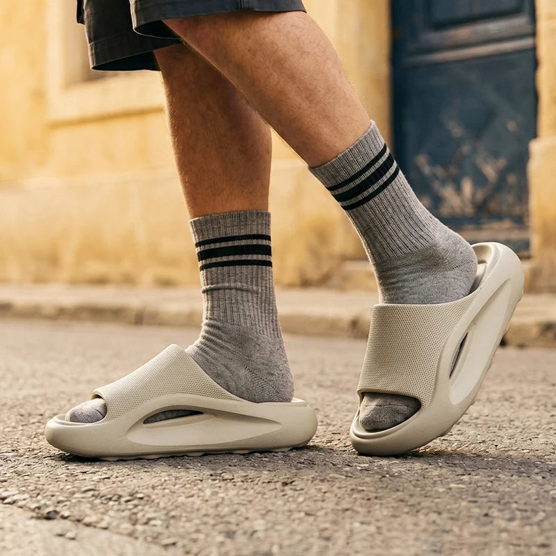 EVA sliders with a thick sole, contoured footbed and wide band across the instep