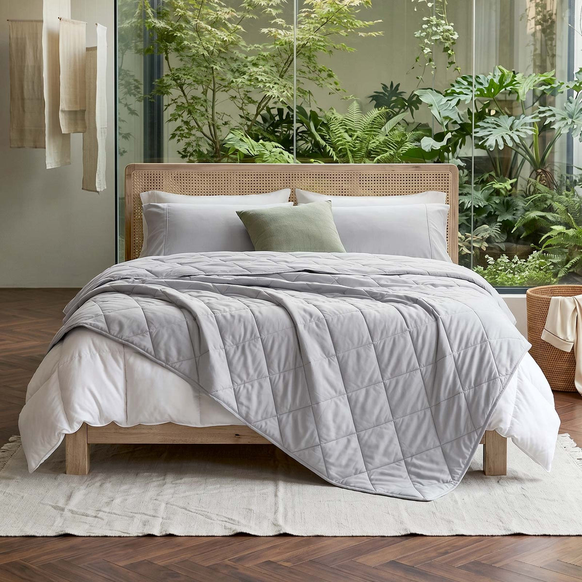 Light cooling blanket with diamond stitching over a made bed - view 2
