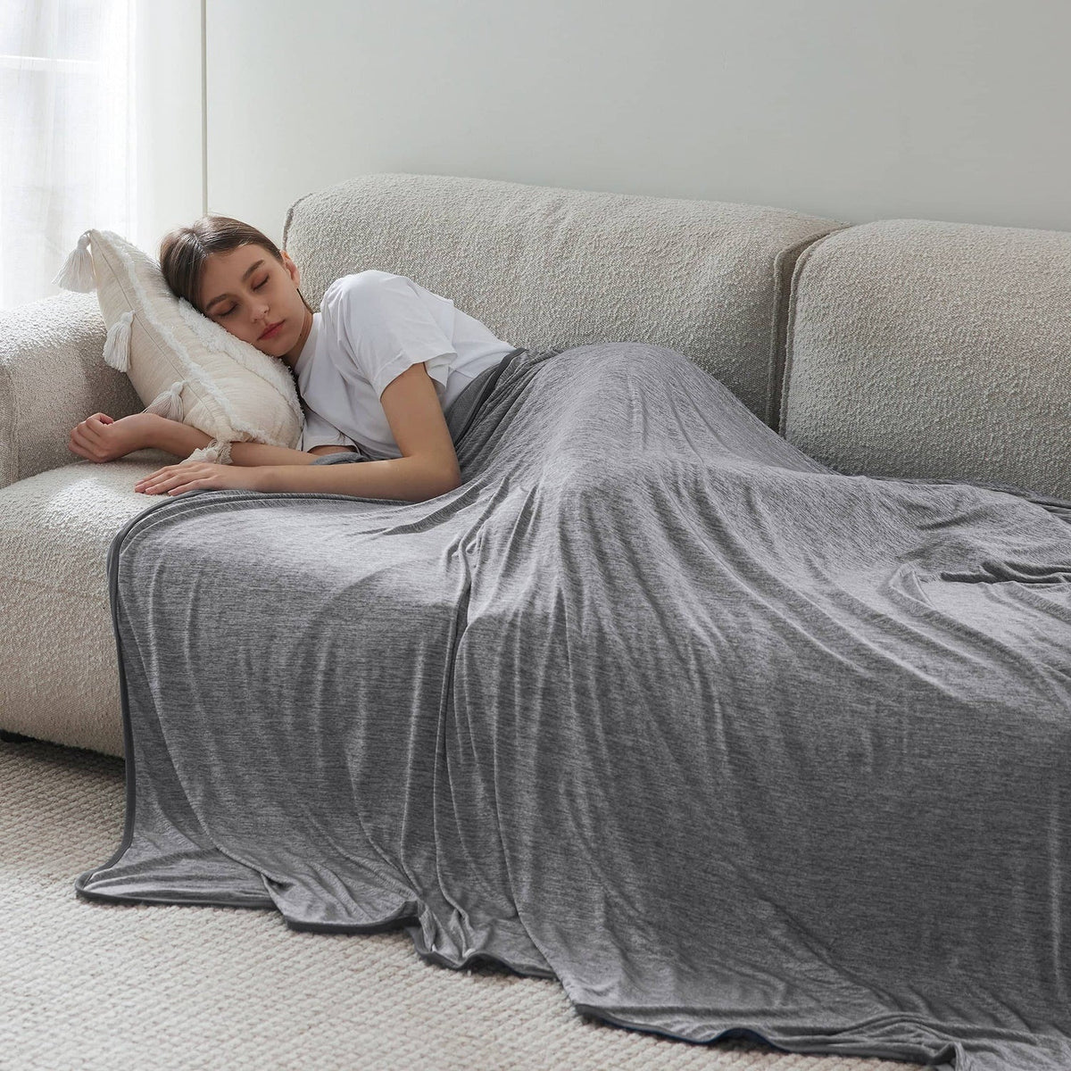 Reversible cooling blanket over a made bed - view 2