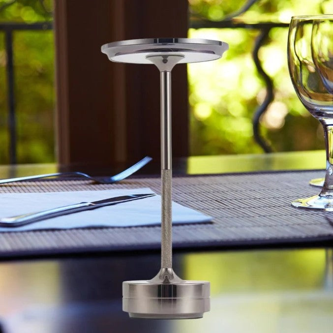 Cordless aluminium table lamp with a flat round shade, slim stem and round base - silver