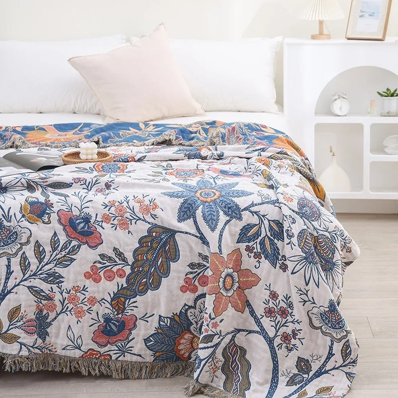 Cotton jacquard throw with a floral pattern and fringe over a sofa - view 2