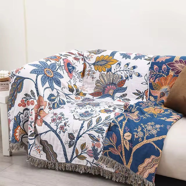 Cotton jacquard throw with a floral pattern and fringe over a sofa - view 3