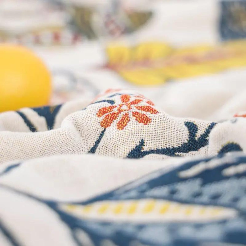 Cotton jacquard throw with a floral pattern and fringe over a sofa - view 8