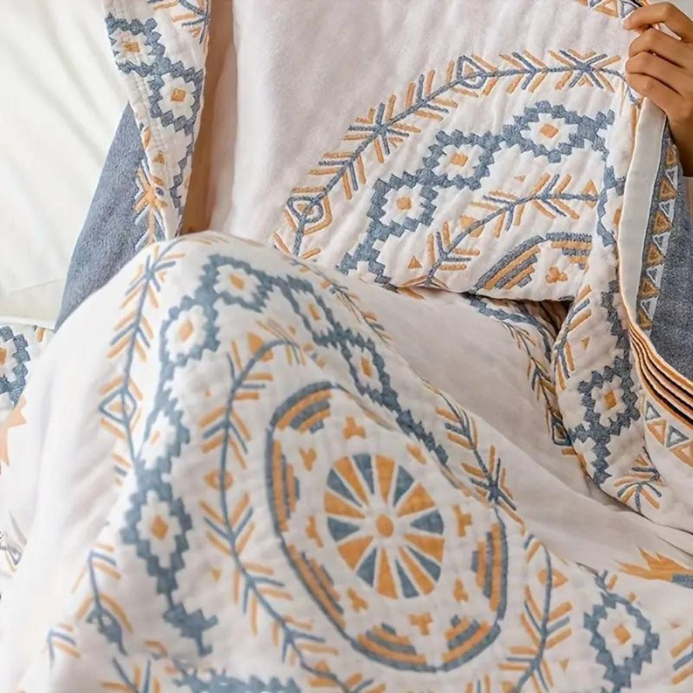Cotton throw with a mandala print over a made bed - view 6