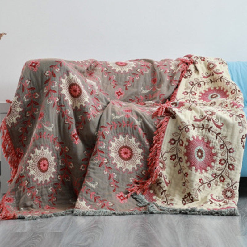 Reversible cotton throw with a medallion pattern and fringe - grey and red