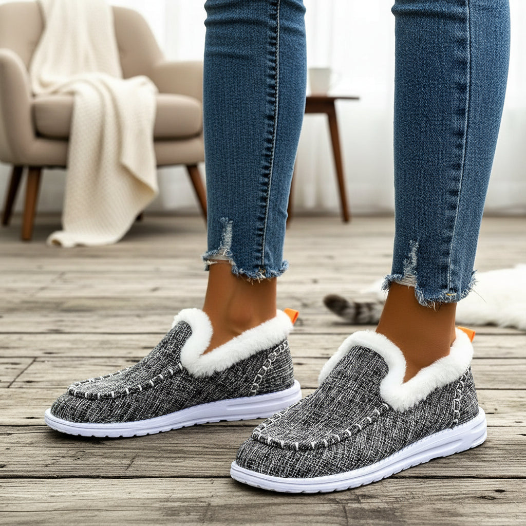 Fleece-lined slip-on shoes with a moccasin seam and a white cushioned sole in grey marl