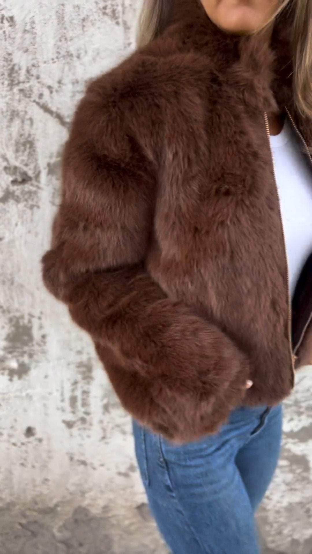 Women's cropped faux fur jacket with a stand collar and gold-tone zip