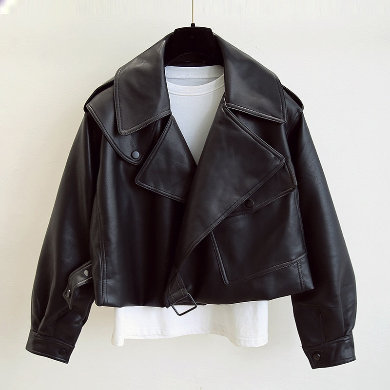 Women's cropped faux leather biker jacket with a wide collar and buckle