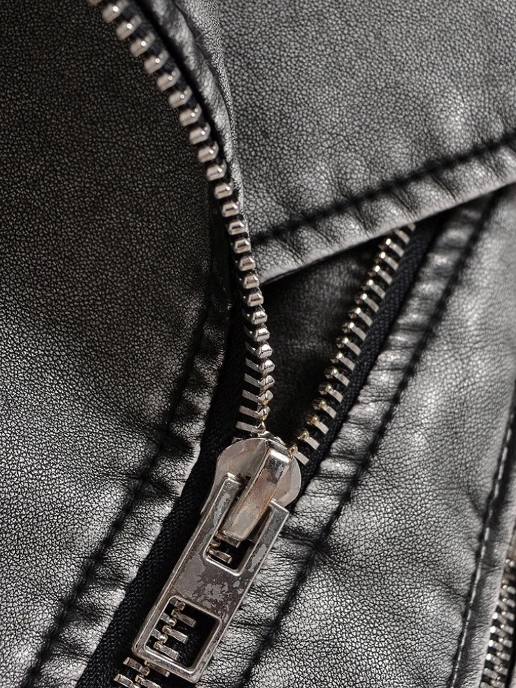 Women's cropped biker jacket in washed faux leather with an asymmetric zip and belt