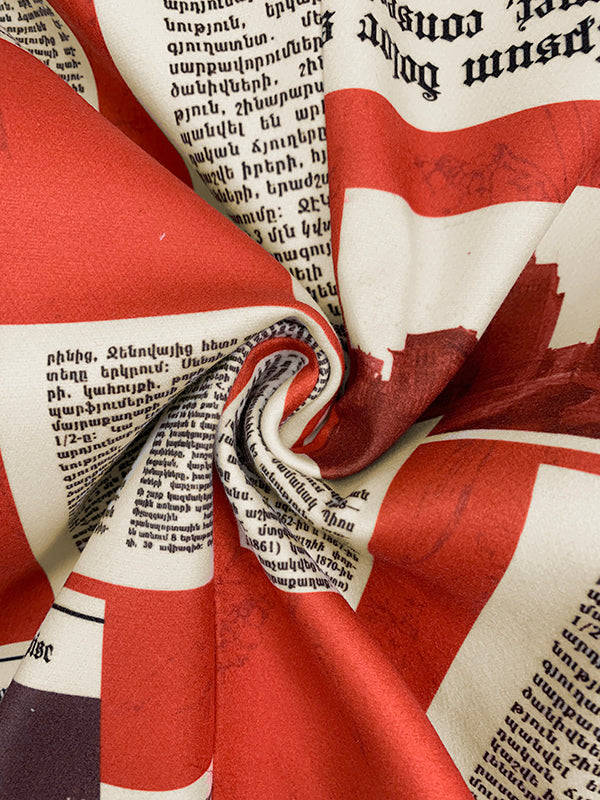 Blazer printed with newsprint columns in red and cream