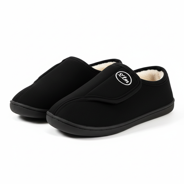 Unisex wide-fit slippers in a suede look with a touch-close strap and fleece lining in black