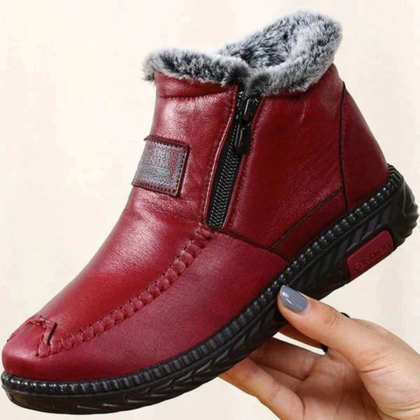 Leather-look ankle boots with a side zip and a thick faux fur lining