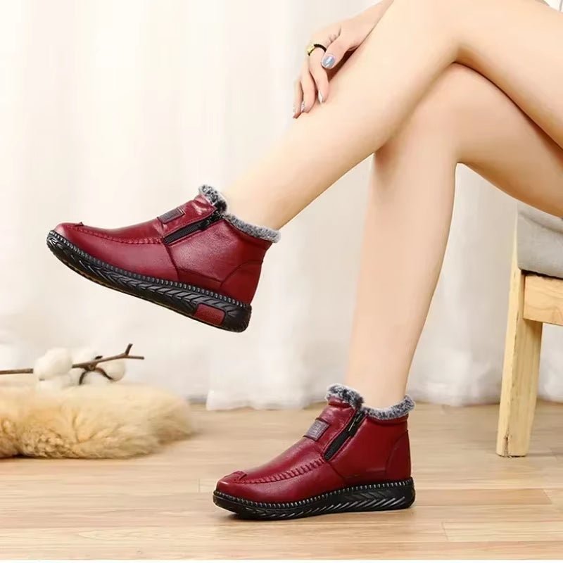 Leather-look ankle boots with a side zip and a thick faux fur lining