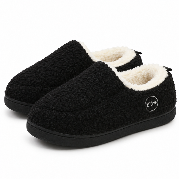 Unisex sherpa loafer slippers with a fleece collar and a heel tab in black