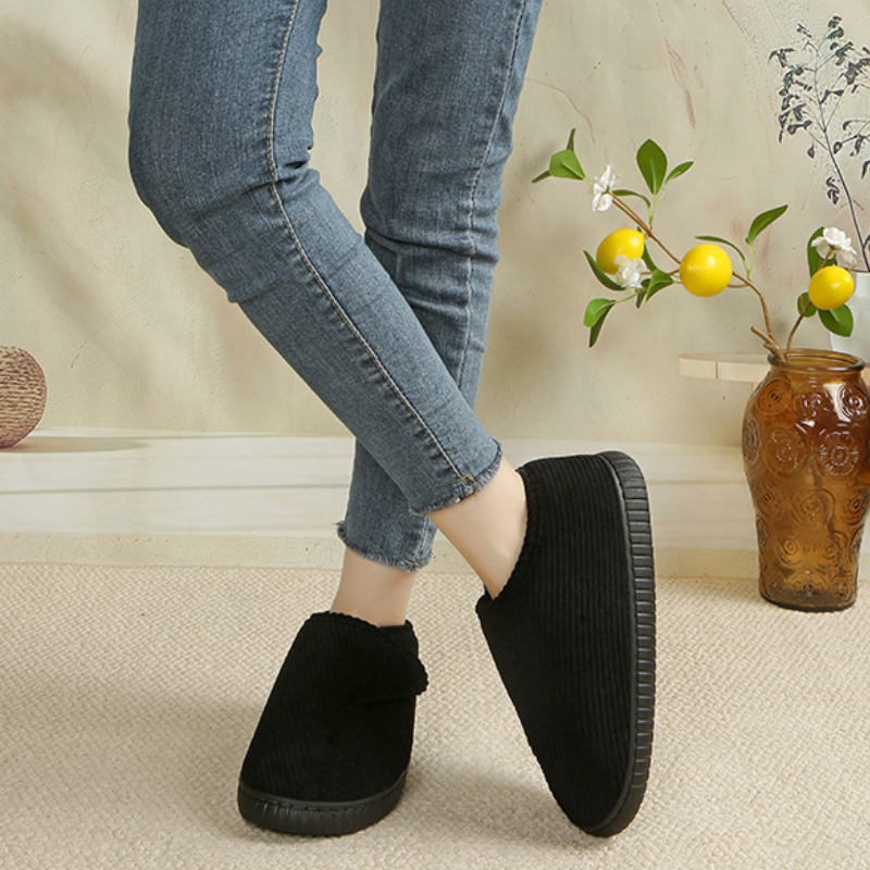 Unisex corduroy house shoes with an adjustable strap and a fleece lining