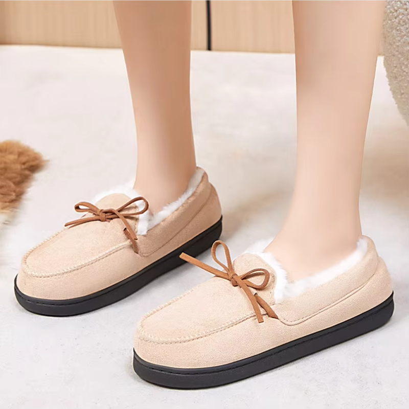 Women's moccasin slippers with a tied bow and a fleece lining