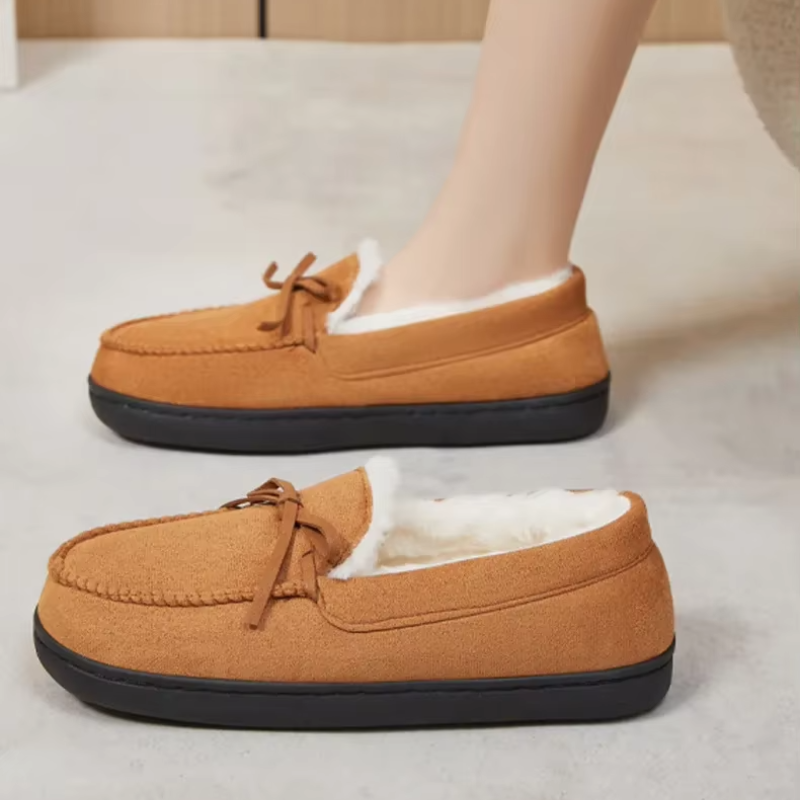 Women's moccasin slippers with a tied bow and a fleece lining