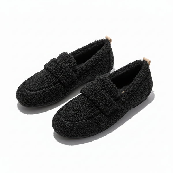 Women's teddy fleece loafer slippers with a wide band and a lug sole in black
