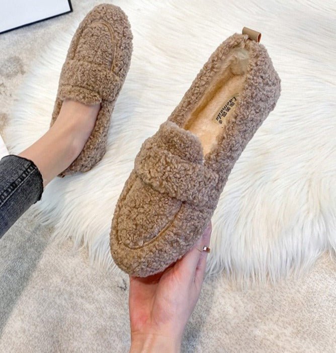 Women's teddy fleece loafer slippers with a wide band and a lug sole