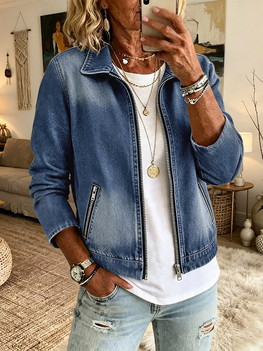Denim jacket with a zip front and slanted zip pockets in mid wash