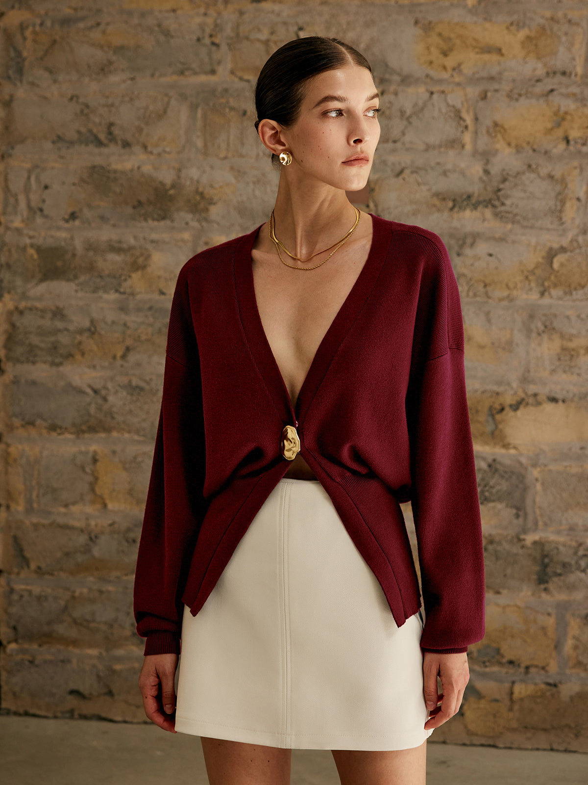Women's deep V-neck cardigan with a single gold-tone button at the waist - burgundy
